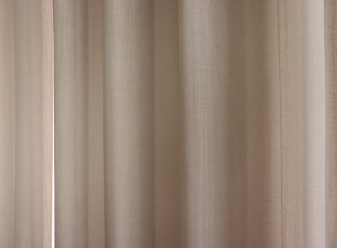 Sheer curtains with natural finishes